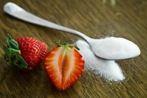 Sliced Strawberry with Spoon of Sugar