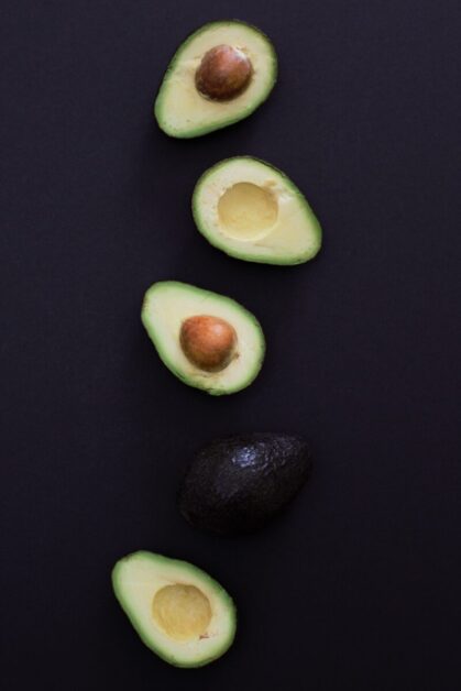 Sliced Avocados on Black Background