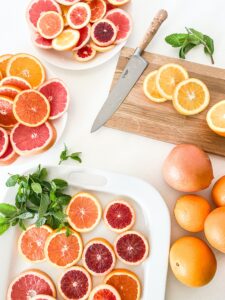 Slices of Citrus Fruit with Knife and Cutting Board