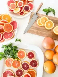 Slices of Citrus Fruit with Knife and Cutting Board