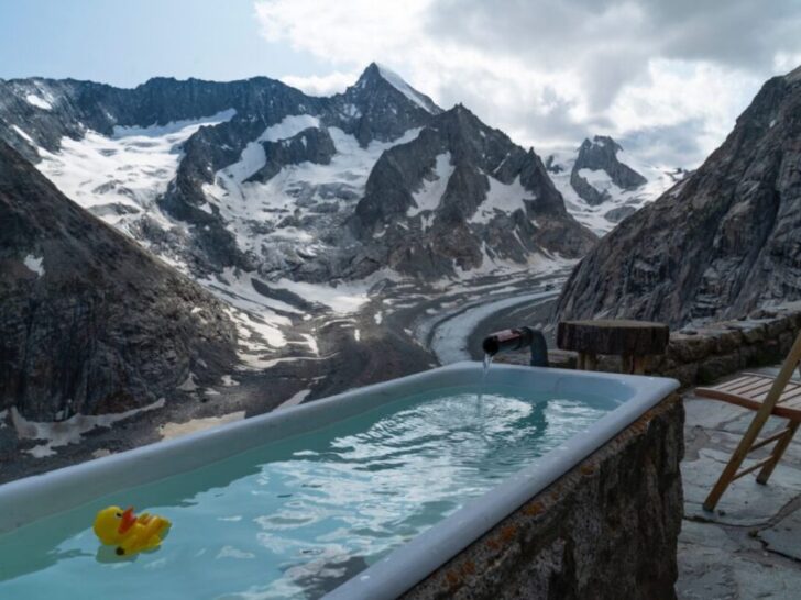 Yellow Toy Duck Floating in Pool in Snowy Mountains