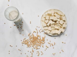 Cut tofu on a white table, as featured on a blog about healthy eating hacks