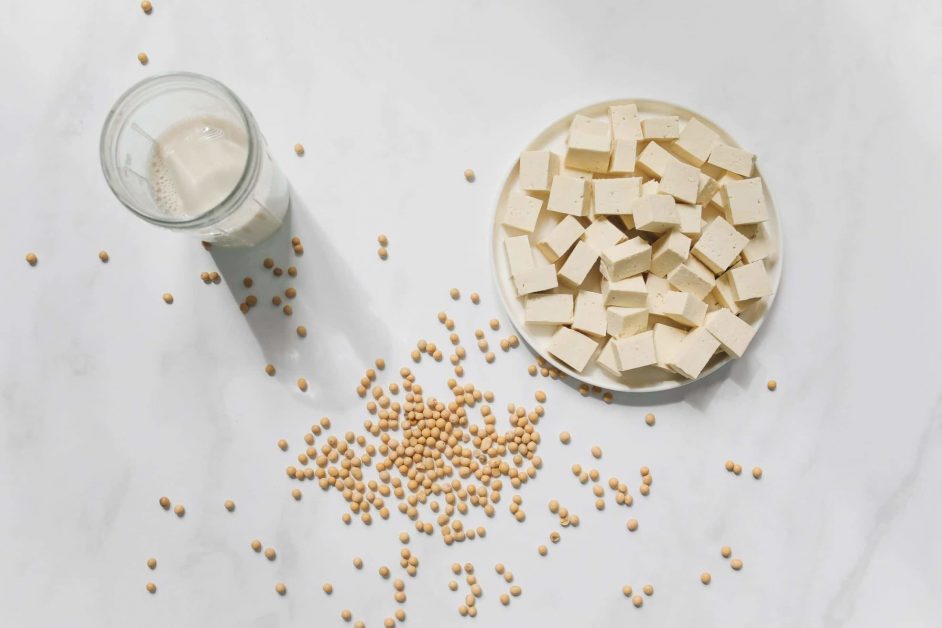 Cut tofu on a white table, as featured on a blog about healthy eating hacks