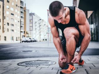 Man Tying His Running Shoes