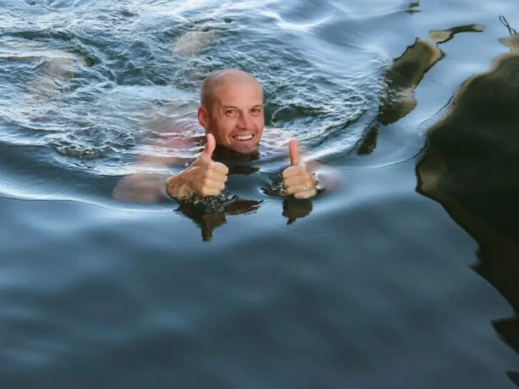 Guy Giving Thumbs Up In Water