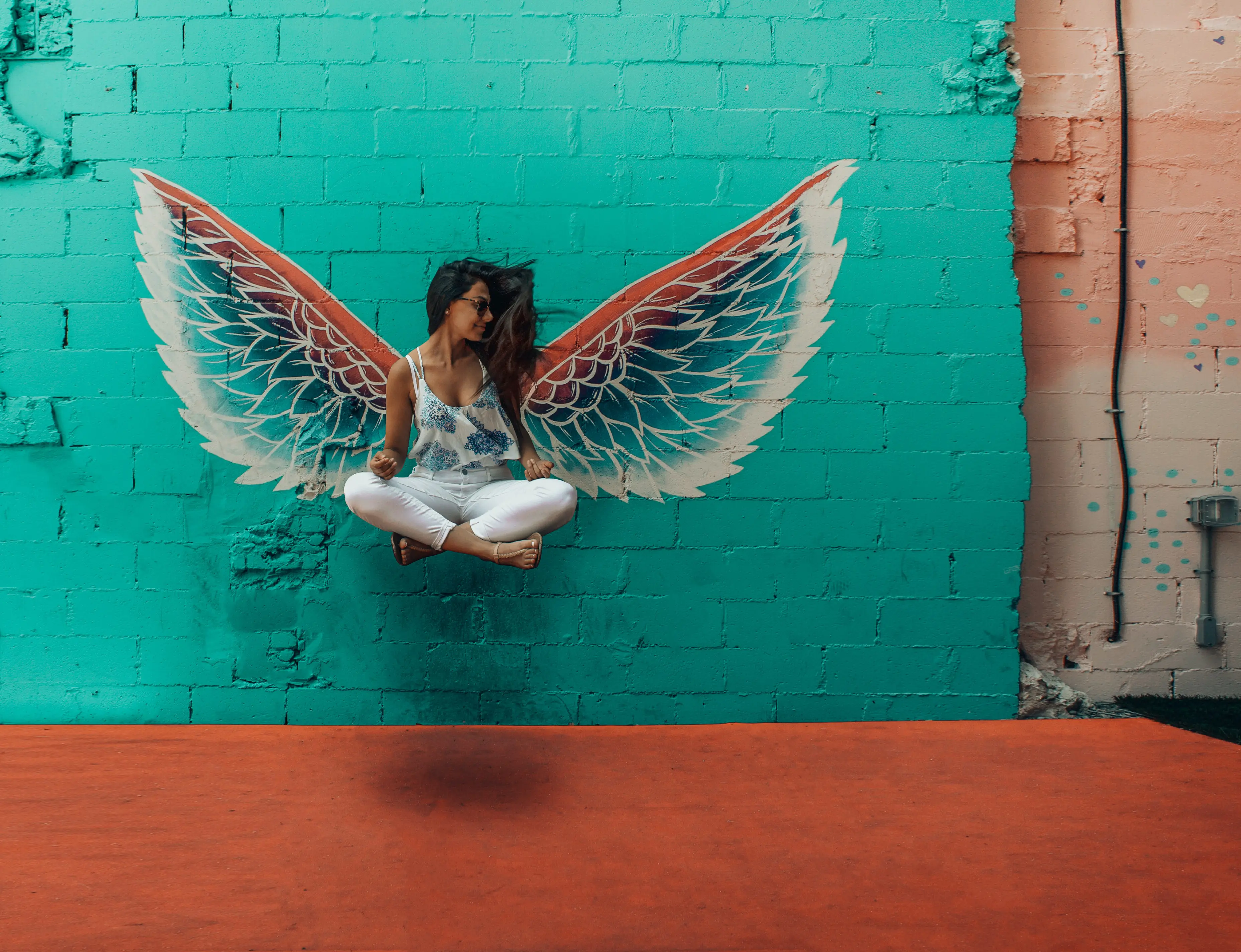 A woman floating and meditating after reading a blog about healthy food and supplements