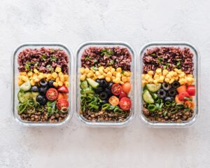 Three Food Containers with Salads