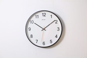 Analog Clock on White Wall