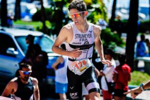 Man Running in Triathlon in Sunglasses