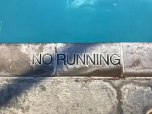 No Running Sign Next to Pool