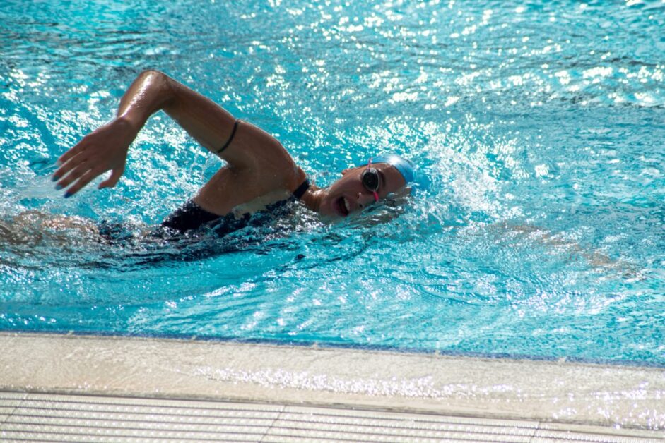 Woman Swimming in Pool