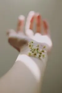 Woman's Arm with Flower on Top