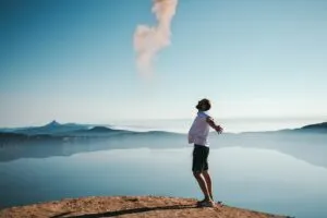 Man Standing on Beach Yelling