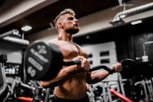 Guy Doing Curl with Shirt Off