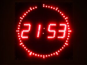 Digital Clock with Red Numbers Showing 21:53
