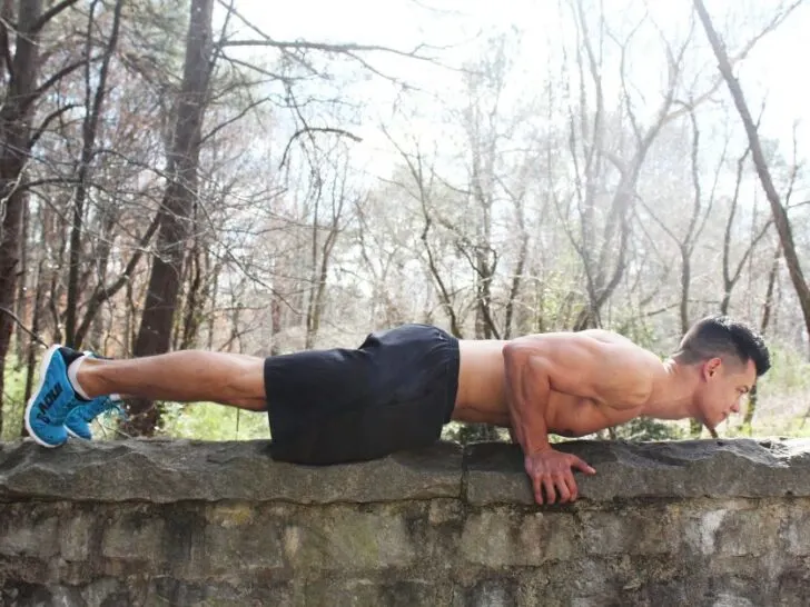 Guy Doing Push Up on Rock Wall Without Shirt