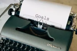Typewriter with White Page That Says Goals