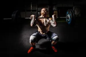 Guy Doing Front Squat with Barbell on Shoulders