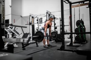 Woman Deadlifting in Gym