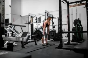 Woman Deadlifting in Gym