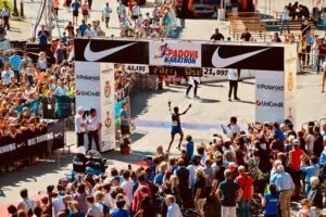 Runner Crossing the Finish Line At Marathon