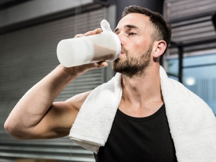 man drinking protein shake
